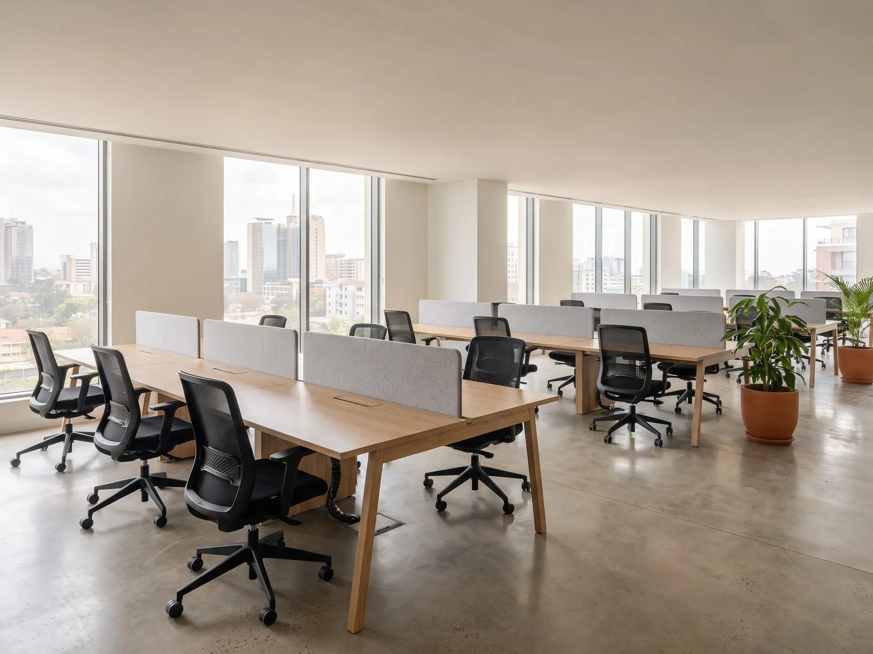 A furnished open-plan office in Nairobi with desks, task chairs and storage