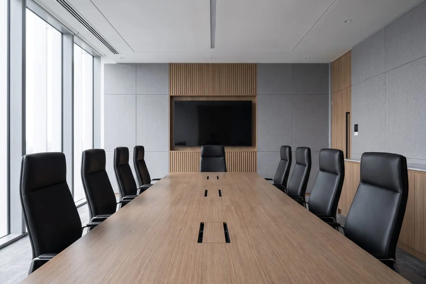Boardroom with a long meeting table and matching chairs